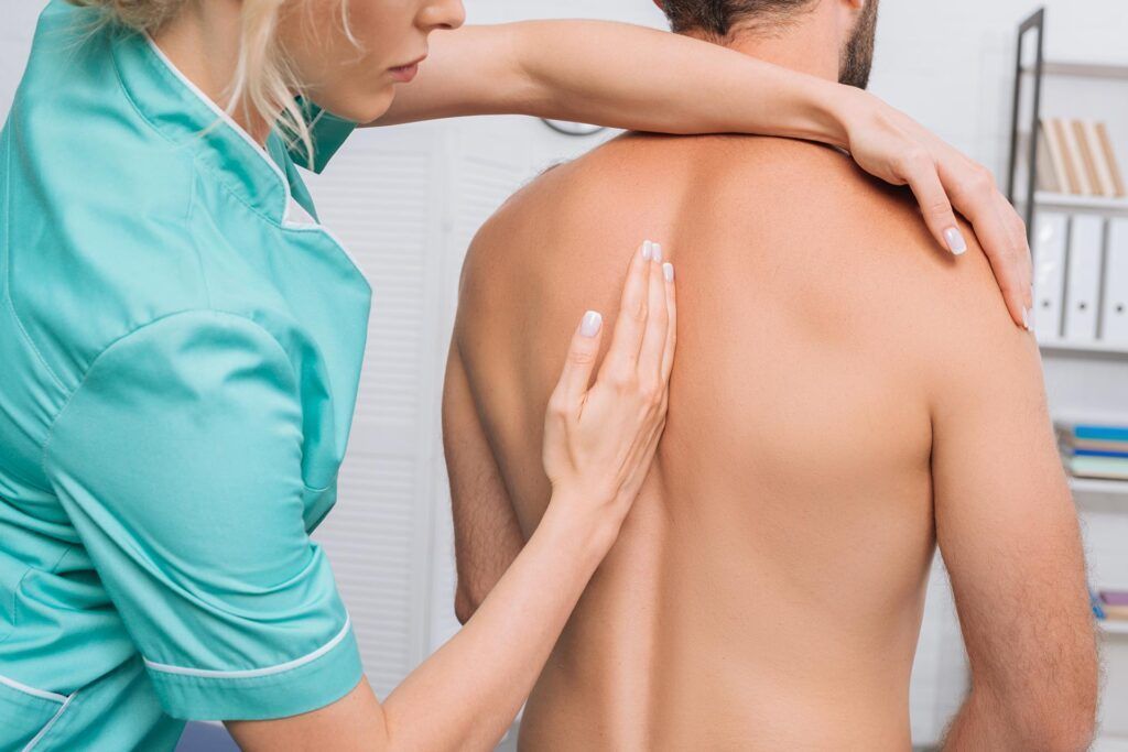 back view of man having chiropractic adjustment in 2023 11 27 04 53 43 utc